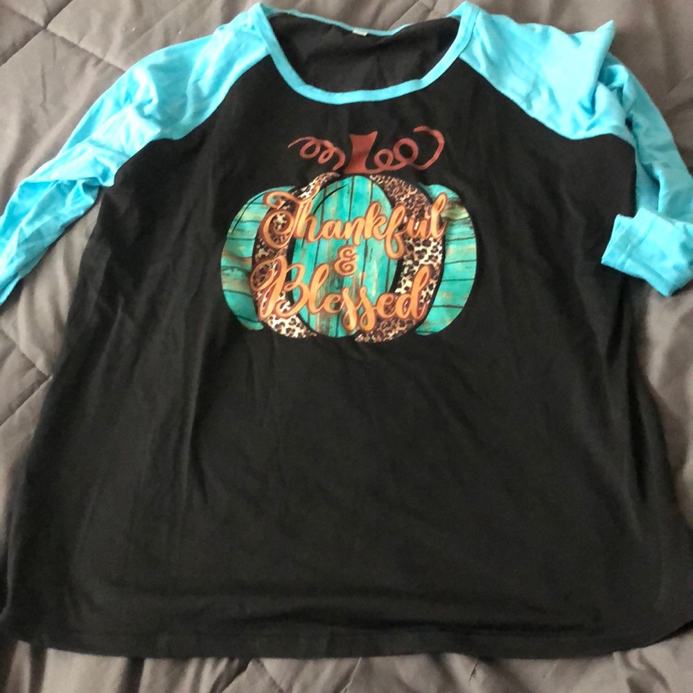 Black baseball shirt with teal sleeves